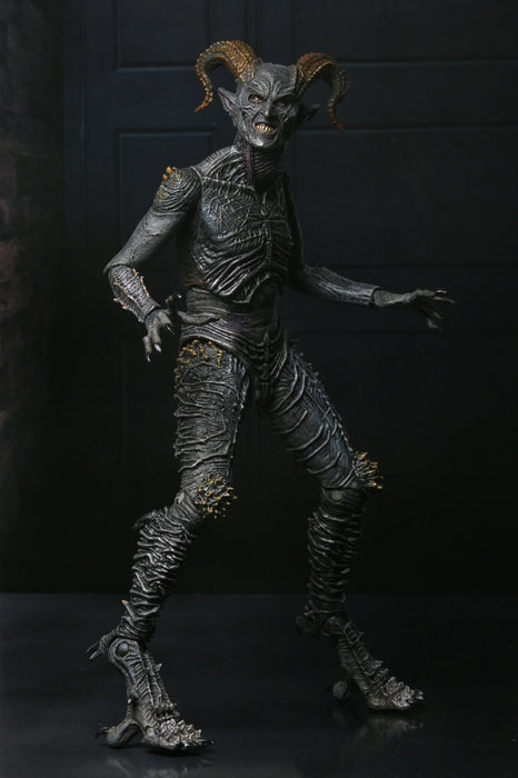 Monster figure with detailed costume and horns against a dark background