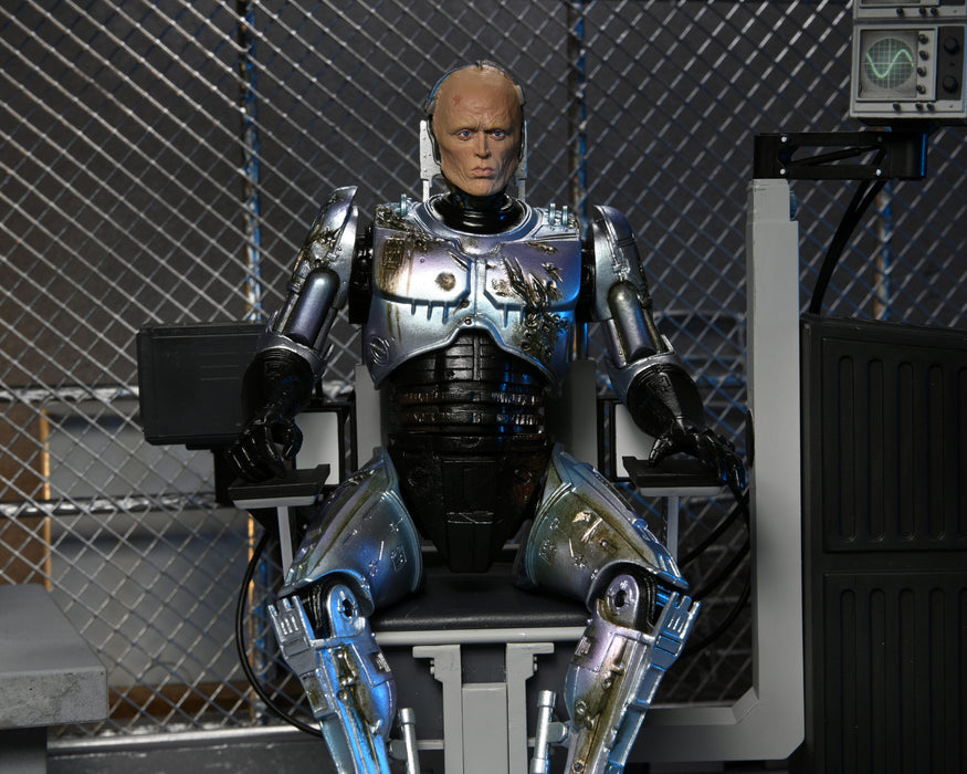 RoboCop Ultimate Battle-Damaged RoboCop with Chair 7-Inch Scale Action Figure